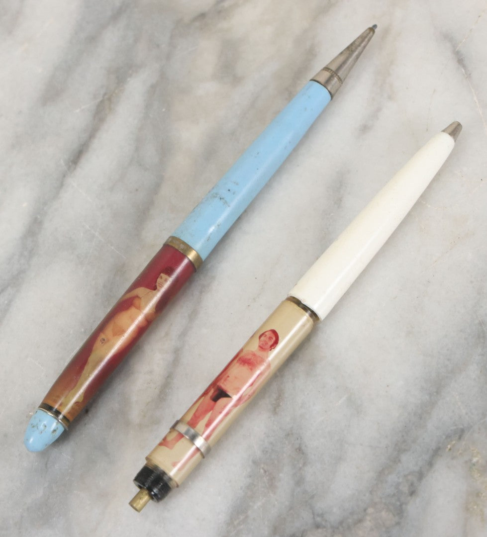 Lot 098 - Pair Of Vintage Pinup Nudie Pens Including Woman With Disappearing Dress And Two Men In Spandex, Note Pen With Men Missing Parts And Nude Effect Not Working, Pens Do Not Write