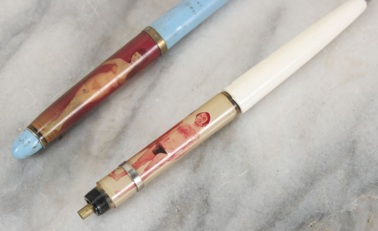 Lot 098 - Pair Of Vintage Pinup Nudie Pens Including Woman With Disappearing Dress And Two Men In Spandex, Note Pen With Men Missing Parts And Nude Effect Not Working, Pens Do Not Write