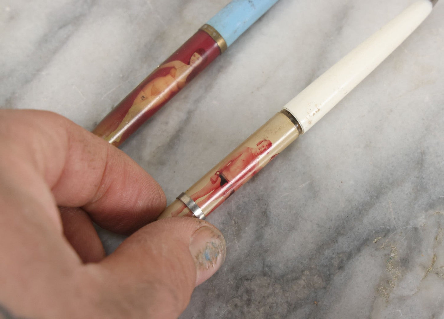 Lot 098 - Pair Of Vintage Pinup Nudie Pens Including Woman With Disappearing Dress And Two Men In Spandex, Note Pen With Men Missing Parts And Nude Effect Not Working, Pens Do Not Write