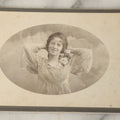 Lot 054 - Antique Cabinet Card Photograph Of A Young Woman In Glasses Posing Playfully With Hands Behind Head, J.W. Brown Photographer, Milford, Massachusetts