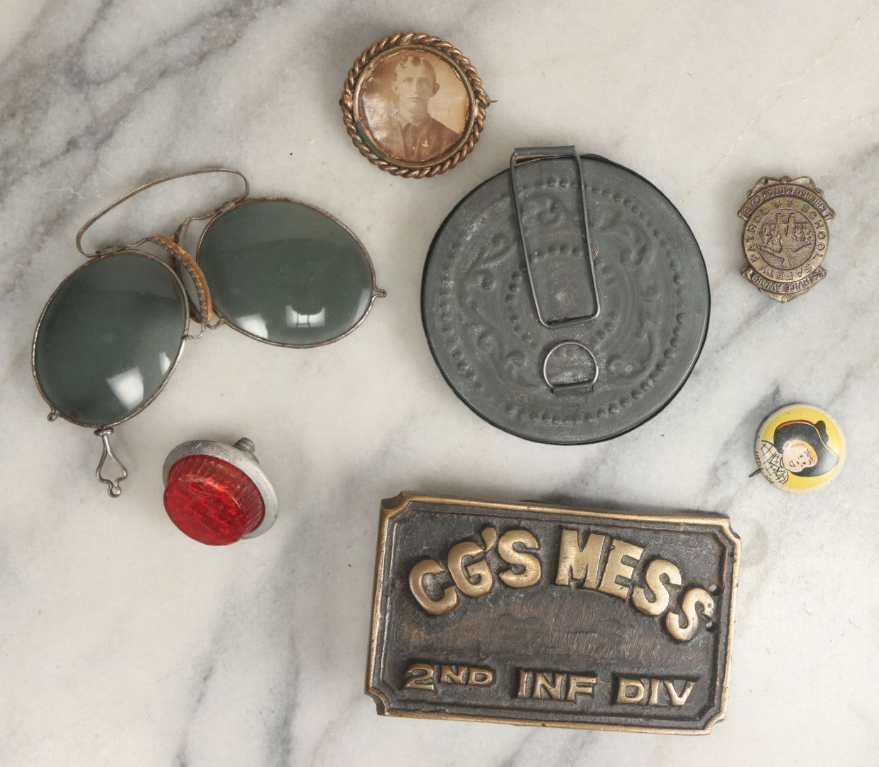 Lot 106 - Seven Piece Mixed Metal Objects Grouping Including Motorcycle License Plate Reflector, Sunglasses, Photo Button, Pocket Mirror, Pinback Button, Belt Buckle, And School Safety Patrol Button