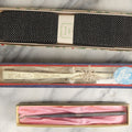 Lot 108 - Grouping Of Three Boxed Ladies Dresser Items Including Corset Hook, Hand Fan, And Xmas Greetings Textile