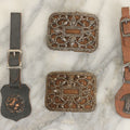 Lot 165 - Four Piece Vintage Grouping Including Two Watch Fobs And Two Blingy Steel Cut Buckles