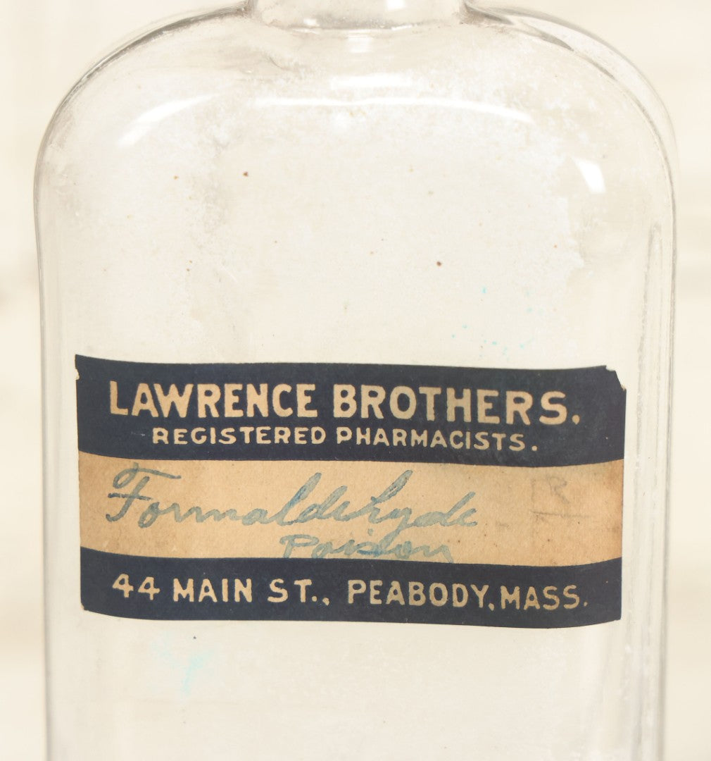 Lot 025 - Antique Lawrence Brothers Registered Pharmacists, Peabody, Massachusetts Glass Pharmacy Bottle With Handwritten Formaldehyde Poison Label