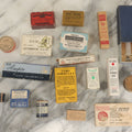 Lot 074 - Grouping Of 18 Boxed Pharmacy Items Including Ideal Syringe, Toppan's Laxative Cold Capsules, Mearig Throat Lozenges, And More