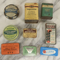 Lot 075 - Grouping Of Nine Pharmacy Tins (Larger Size) Including Unguentine Analgesic, Bab Tablets, And Watkins Menthol Ointment