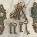 Lot 021 - Grouping Of Ten Antique Skeleton Keys And Two Ornate Antique Doorknob Mount Escutcheons, As Found