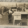 Lot 038 - Vintage Large Format Photograph Of Smiling Child Holding A Chicken At A Country Fair Beside An Oven