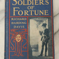 Lot 052 - "Soldiers Of Fortune", Antique Novel By Richard Harding Davis, Play-Goers Edition, Published After The Dramatisation By Augustus Thomas, Illustrated With Photographs Of The Play, Charles Scribner's Sons, Publishers, New York, 1902