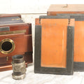 Lot 001 - Antique Wooden Camera By American Optical Company, Scovill Manufacturing Company, Proprietors, With New York, With Lens (Does Not Fit Camera) And Case From M.B. Loughman Photographic Apparatus, Boston - See Condition Notes