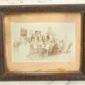Lot 094 - Antique Framed Boarded Photograph Of A Large Family Gathering Meal Outside, Possibly Thanksgiving Or Like Occasion, With Many Men, Women, And Children In Photo, Overall Dimensions 11-1/2" x 9-3/8"