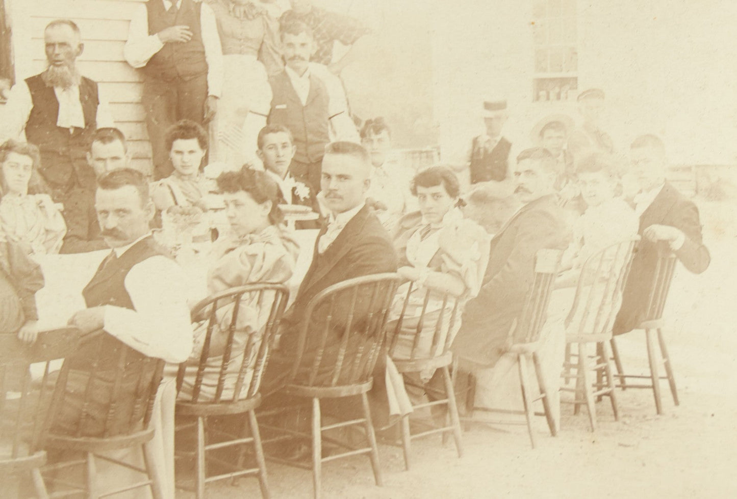 Lot 094 - Antique Framed Boarded Photograph Of A Large Family Gathering Meal Outside, Possibly Thanksgiving Or Like Occasion, With Many Men, Women, And Children In Photo, Overall Dimensions 11-1/2" x 9-3/8"