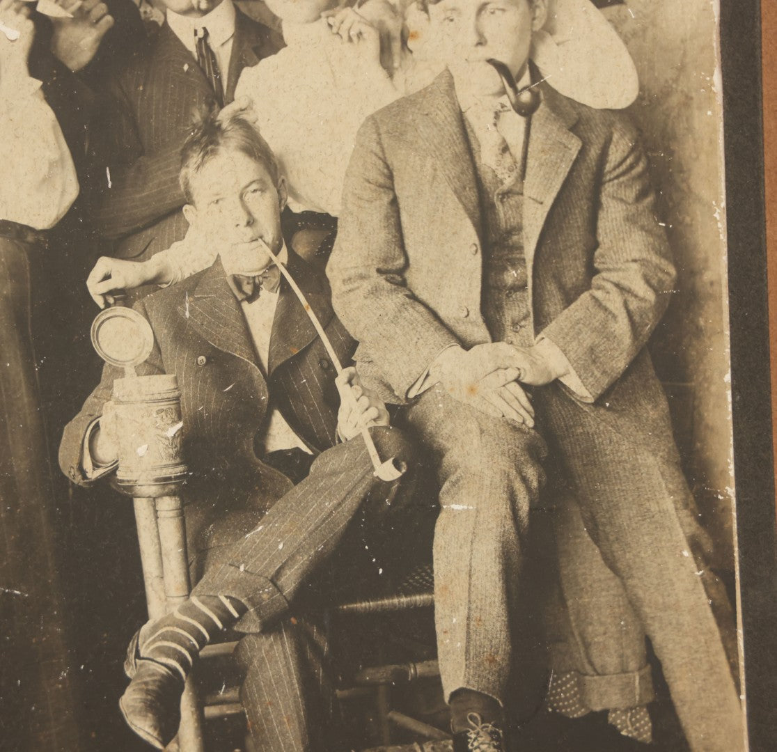 Lot 098 - Antique Boarded Photograph Of Friends Goofing Off, Smoking Pipes, Two Women And Five Men, Titled "The Degenerates" On Verso, Note Loss To Right Side Of Board