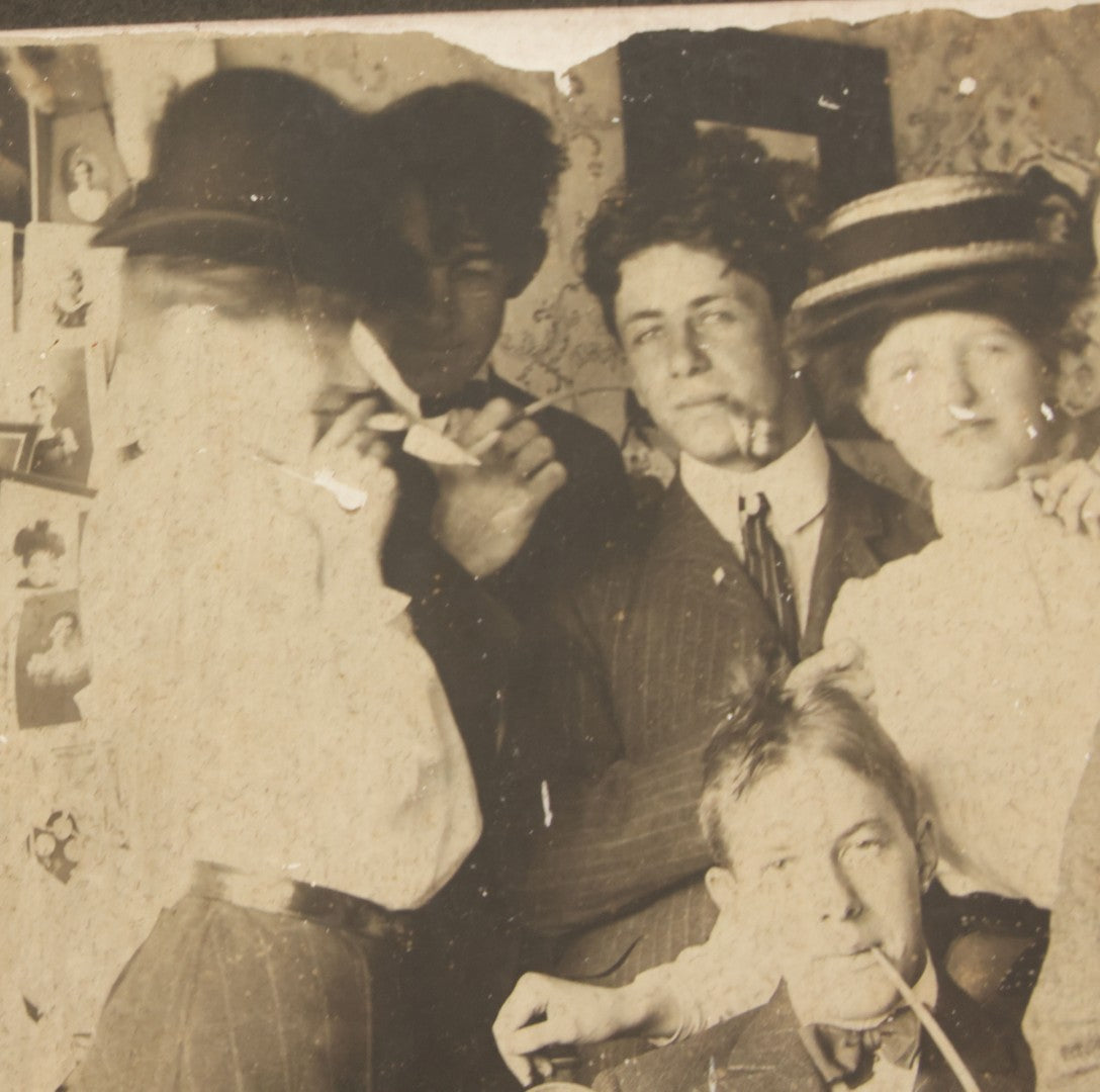 Lot 098 - Antique Boarded Photograph Of Friends Goofing Off, Smoking Pipes, Two Women And Five Men, Titled "The Degenerates" On Verso, Note Loss To Right Side Of Board
