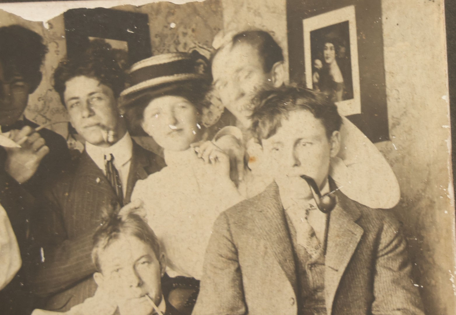 Lot 098 - Antique Boarded Photograph Of Friends Goofing Off, Smoking Pipes, Two Women And Five Men, Titled "The Degenerates" On Verso, Note Loss To Right Side Of Board