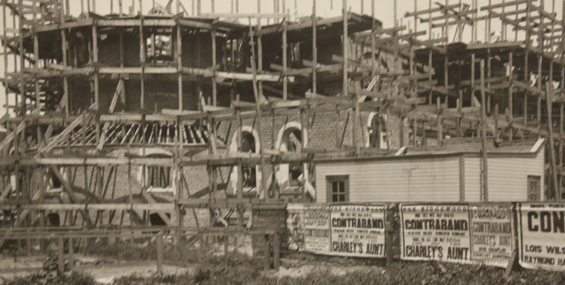 Lot 100 - Single Antique Boarded Photo Depicting A Building Under Construction, Possibly A Church In Queens, New York, With Posters Advertising The Fox Ridgewood Theater, Photo Marked "Condition Of Operations, May 19, 1925"