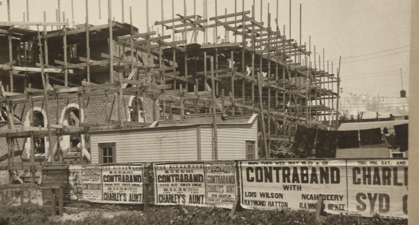 Lot 100 - Single Antique Boarded Photo Depicting A Building Under Construction, Possibly A Church In Queens, New York, With Posters Advertising The Fox Ridgewood Theater, Photo Marked "Condition Of Operations, May 19, 1925"