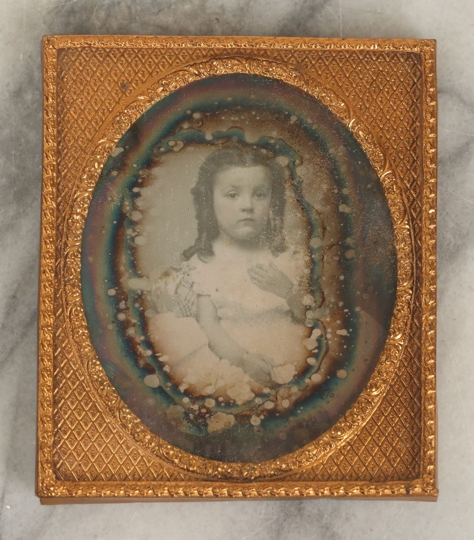 Lot 013 - Antique 1/6th Plate Daguerreotype Photograph Of A Young Girl In A White Dress Holding Her Hand To Her Chest, In Thermoplastic Case Manufactured By Hoolmes, Booth, & Haydens' Daguerreotype, Photographic, And Ambrotype Goods