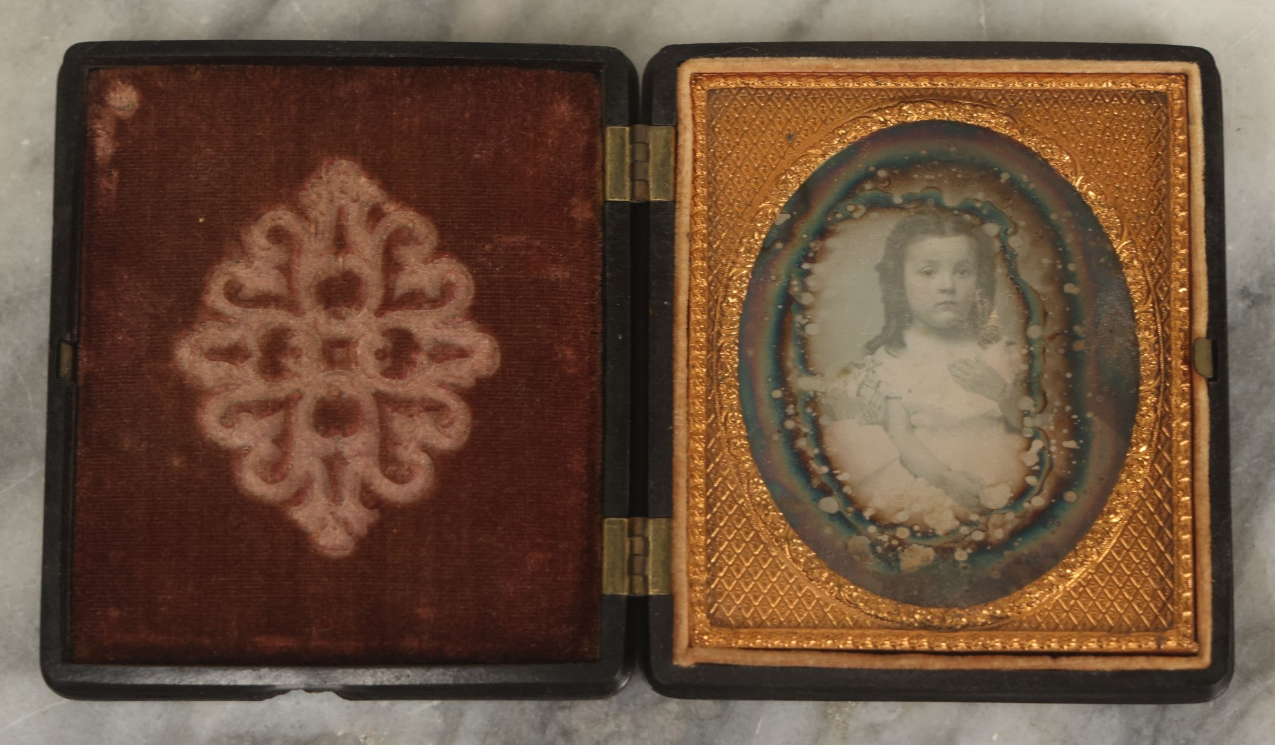 Lot 013 - Antique 1/6th Plate Daguerreotype Photograph Of A Young Girl In A White Dress Holding Her Hand To Her Chest, In Thermoplastic Case Manufactured By Hoolmes, Booth, & Haydens' Daguerreotype, Photographic, And Ambrotype Goods