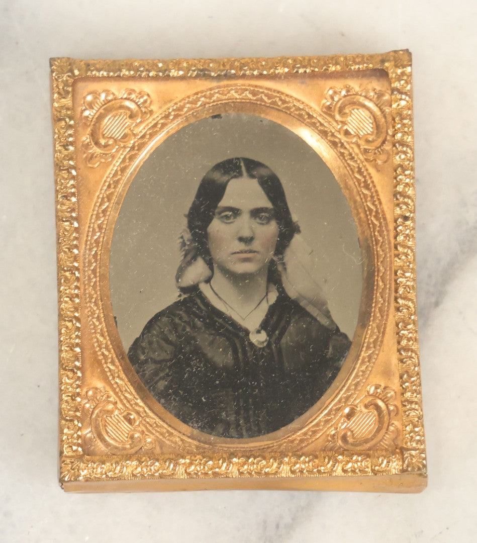 Lot 014 - Antique 1/16th Plate Ruby Ambrotype Photograph Of A Pretty Young Woman With A Long Ribbon In Her Hair In A Pictorial Thermoplastic Case Manufactured By Hoolmes, Booth, & Haydens' Daguerreotype, Photographic, And Ambrotype Goods