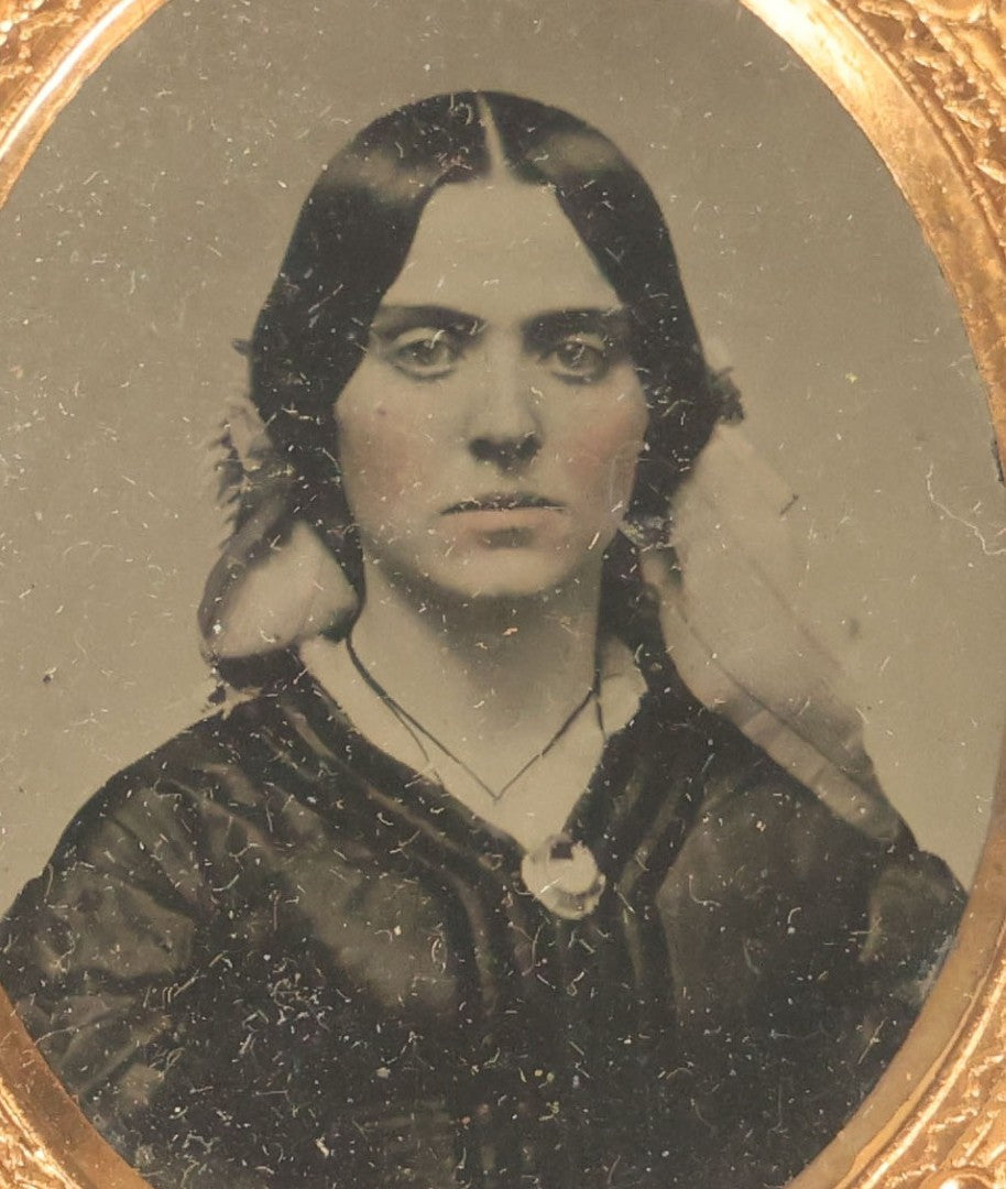 Lot 014 - Antique 1/16th Plate Ruby Ambrotype Photograph Of A Pretty Young Woman With A Long Ribbon In Her Hair In A Pictorial Thermoplastic Case Manufactured By Hoolmes, Booth, & Haydens' Daguerreotype, Photographic, And Ambrotype Goods