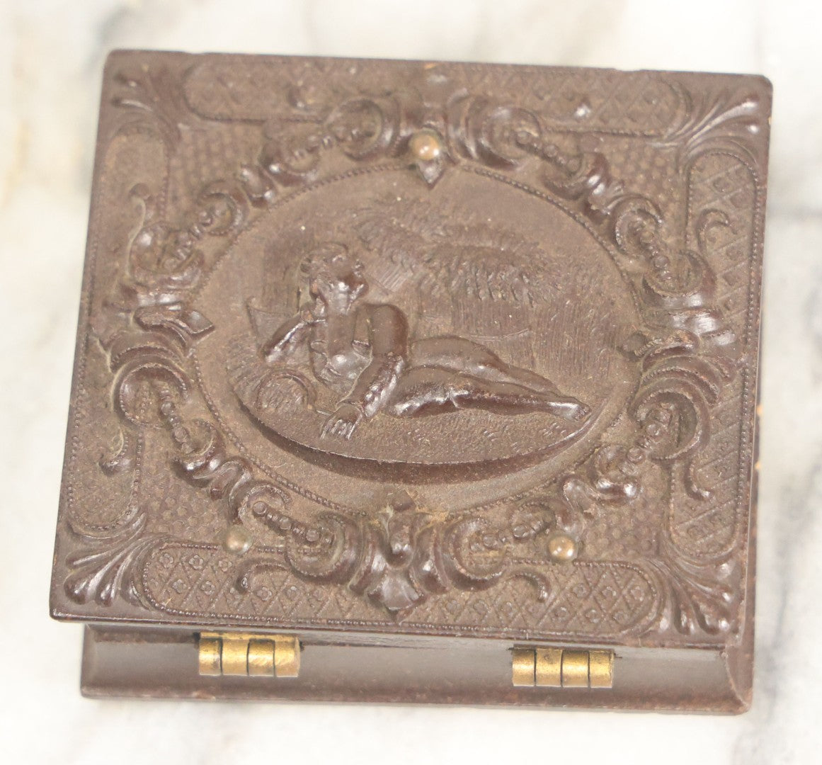 Lot 014 - Antique 1/16th Plate Ruby Ambrotype Photograph Of A Pretty Young Woman With A Long Ribbon In Her Hair In A Pictorial Thermoplastic Case Manufactured By Hoolmes, Booth, & Haydens' Daguerreotype, Photographic, And Ambrotype Goods