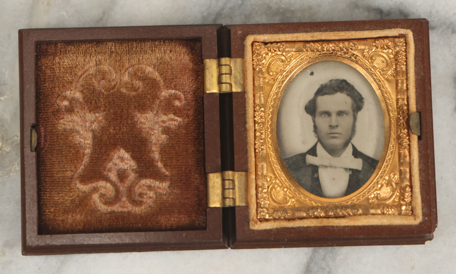 Lot 015 - Antique 1/16th Plate Ambrotype Photograph Of A Man With A 1000 Yard Stare A Comically Wide White Bowtie In A Thermoplastic Case, Genuine Union Case, Improved, Manufactured By S. Peck & Co.