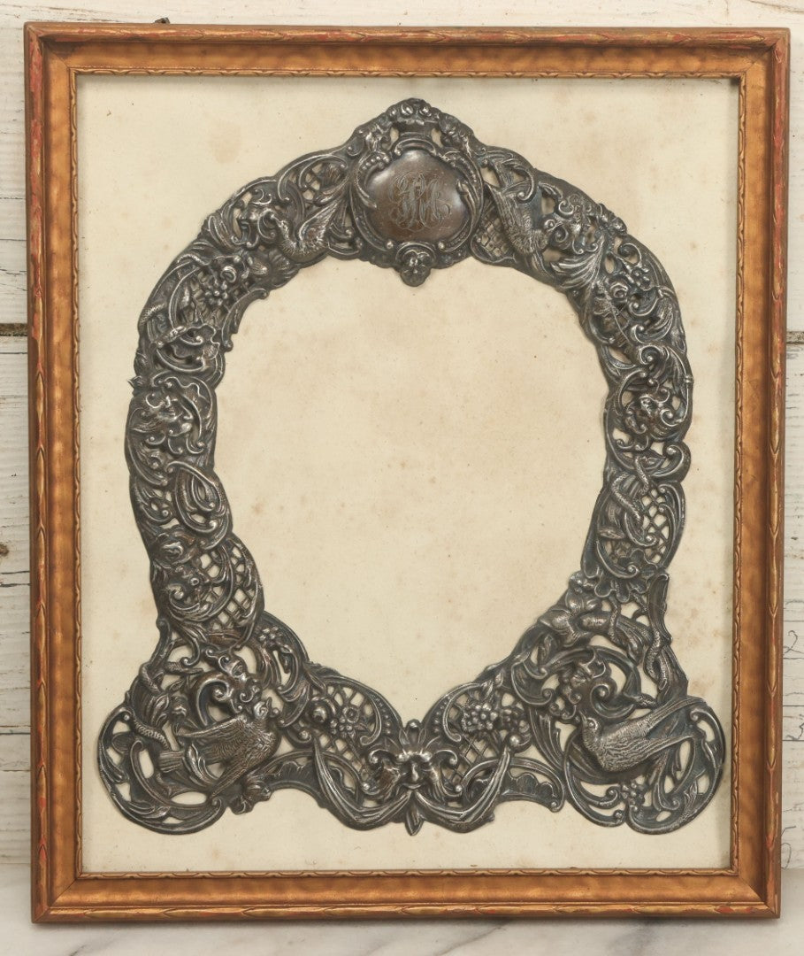 Lot 022 - Antique Sterling Silver Repoussé Gothic Revival Art Nouveau Frame Front With Numerous Green Man Motifs, Framed Behind Glass, Approximately 2.8 Troy Ounces