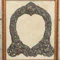 Lot 022 - Antique Sterling Silver Repoussé Gothic Revival Art Nouveau Frame Front With Numerous Green Man Motifs, Framed Behind Glass, Approximately 2.8 Troy Ounces