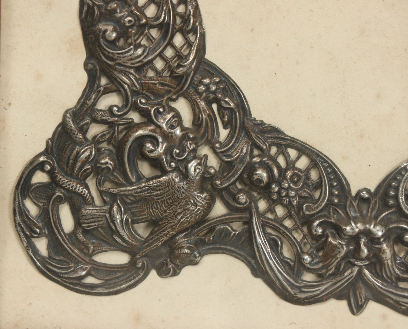 Lot 022 - Antique Sterling Silver Repoussé Gothic Revival Art Nouveau Frame Front With Numerous Green Man Motifs, Framed Behind Glass, Approximately 2.8 Troy Ounces