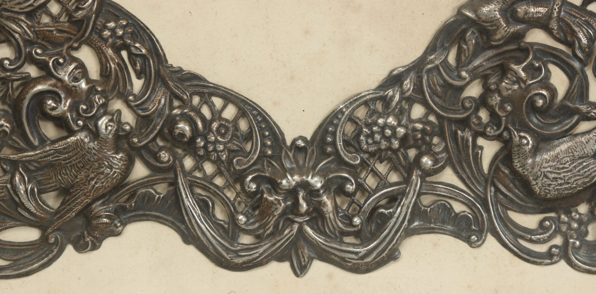 Lot 022 - Antique Sterling Silver Repoussé Gothic Revival Art Nouveau Frame Front With Numerous Green Man Motifs, Framed Behind Glass, Approximately 2.8 Troy Ounces