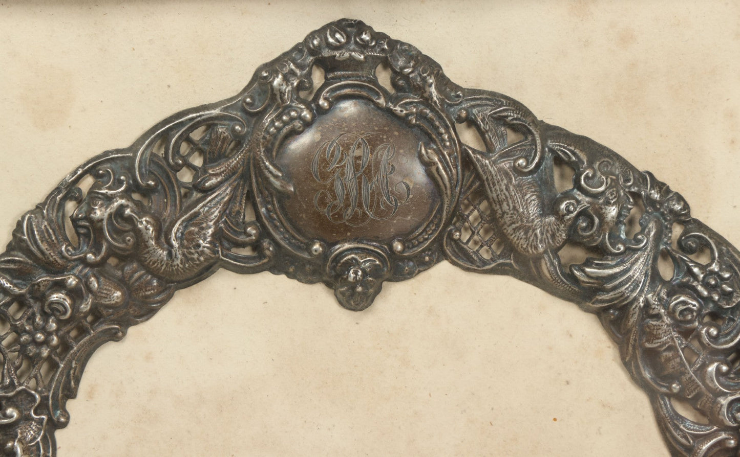 Lot 022 - Antique Sterling Silver Repoussé Gothic Revival Art Nouveau Frame Front With Numerous Green Man Motifs, Framed Behind Glass, Approximately 2.8 Troy Ounces