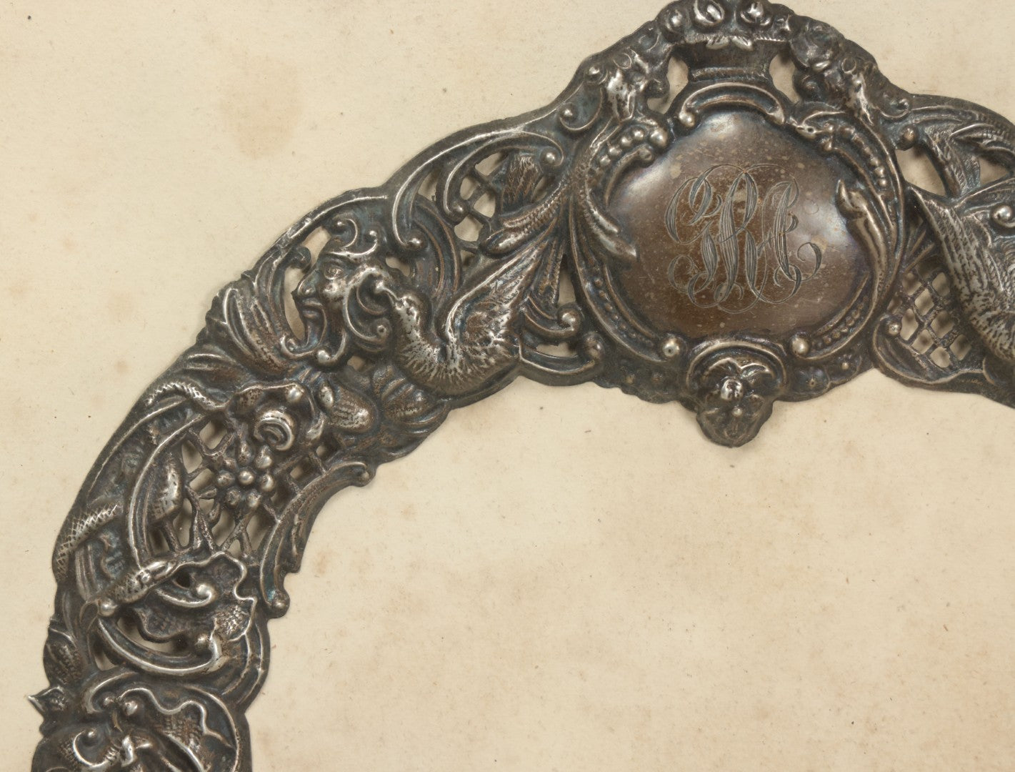 Lot 022 - Antique Sterling Silver Repoussé Gothic Revival Art Nouveau Frame Front With Numerous Green Man Motifs, Framed Behind Glass, Approximately 2.8 Troy Ounces