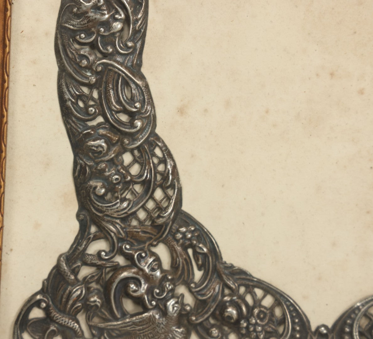 Lot 022 - Antique Sterling Silver Repoussé Gothic Revival Art Nouveau Frame Front With Numerous Green Man Motifs, Framed Behind Glass, Approximately 2.8 Troy Ounces