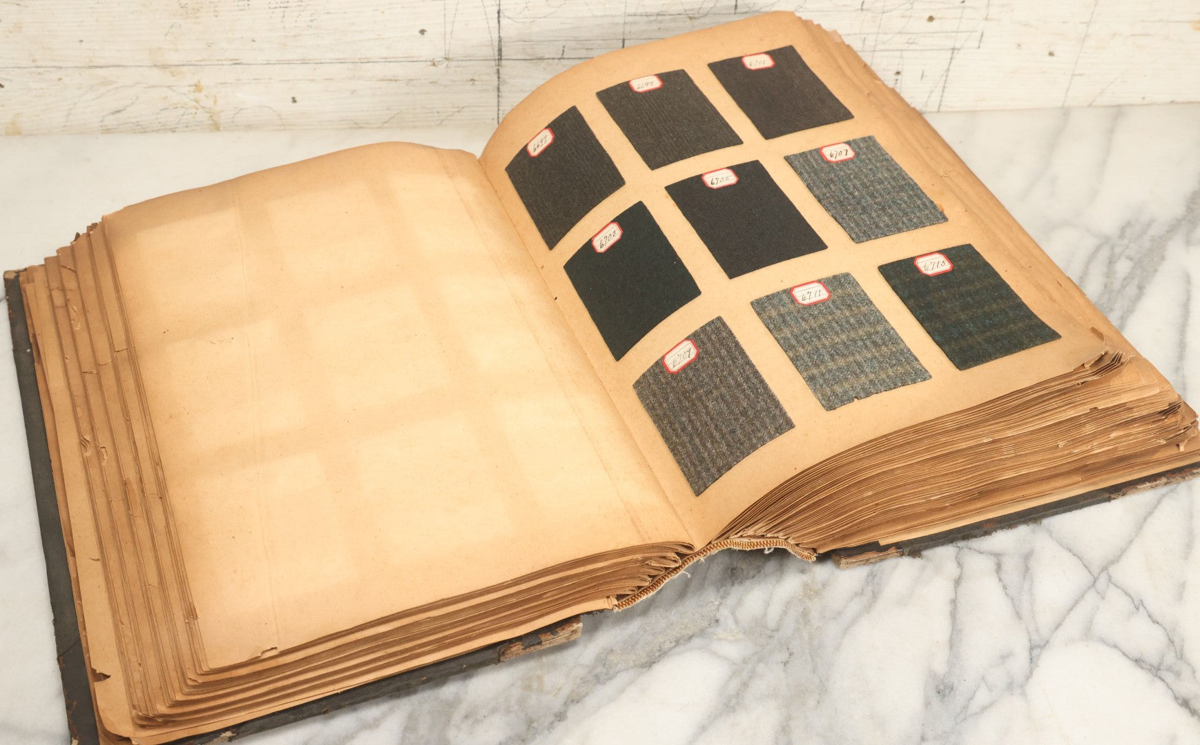 Lot 031 - Antique Sample Fabric Wool Swatch Book From Calumet Woolen Co., Styles No. And/Or Great River Woolen Co., Styles No. 6107-7785, Containing Dozens Of Fabric Samples, Missing Spine Covering, Circa 1894 