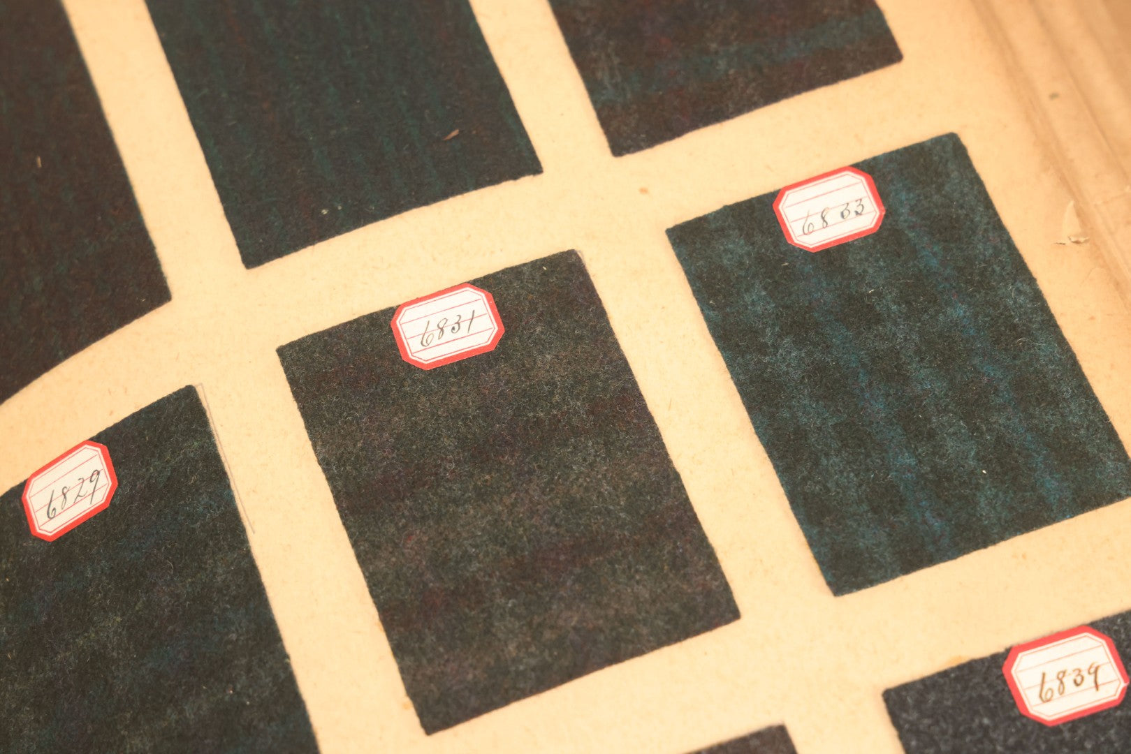 Lot 031 - Antique Sample Fabric Wool Swatch Book From Calumet Woolen Co., Styles No. And/Or Great River Woolen Co., Styles No. 6107-7785, Containing Dozens Of Fabric Samples, Missing Spine Covering, Circa 1894 