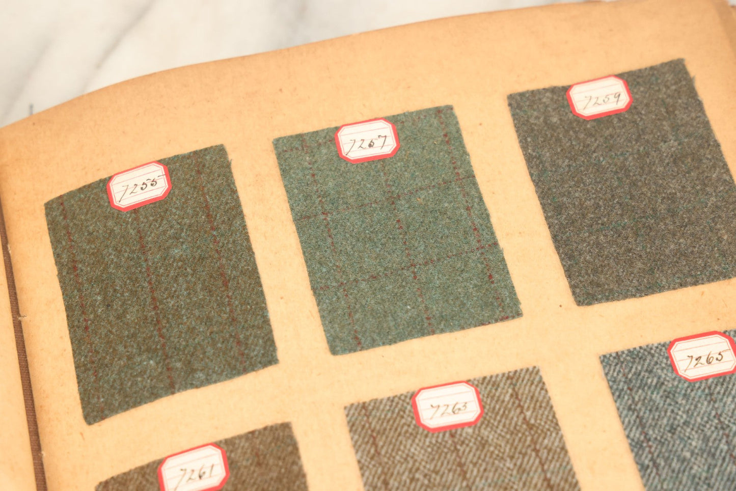 Lot 031 - Antique Sample Fabric Wool Swatch Book From Calumet Woolen Co., Styles No. And/Or Great River Woolen Co., Styles No. 6107-7785, Containing Dozens Of Fabric Samples, Missing Spine Covering, Circa 1894 