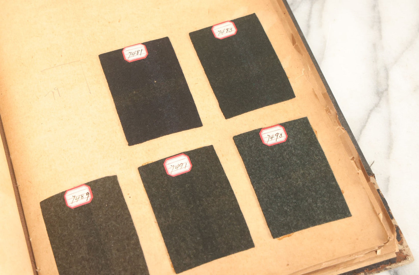 Lot 031 - Antique Sample Fabric Wool Swatch Book From Calumet Woolen Co., Styles No. And/Or Great River Woolen Co., Styles No. 6107-7785, Containing Dozens Of Fabric Samples, Missing Spine Covering, Circa 1894 