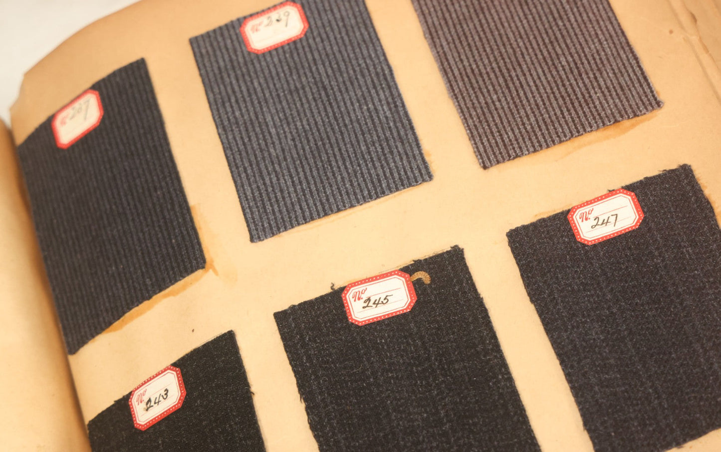 Lot 032 - Antique Sample Fabric Wool Swatch Book From Calumet Woolen Co., Styles No. 1195-1661 & Great River Woolen Co., Styles No. 1-1303, Containing Dozens Of Fabric Samples, Missing Front Cover, Dated 1894 