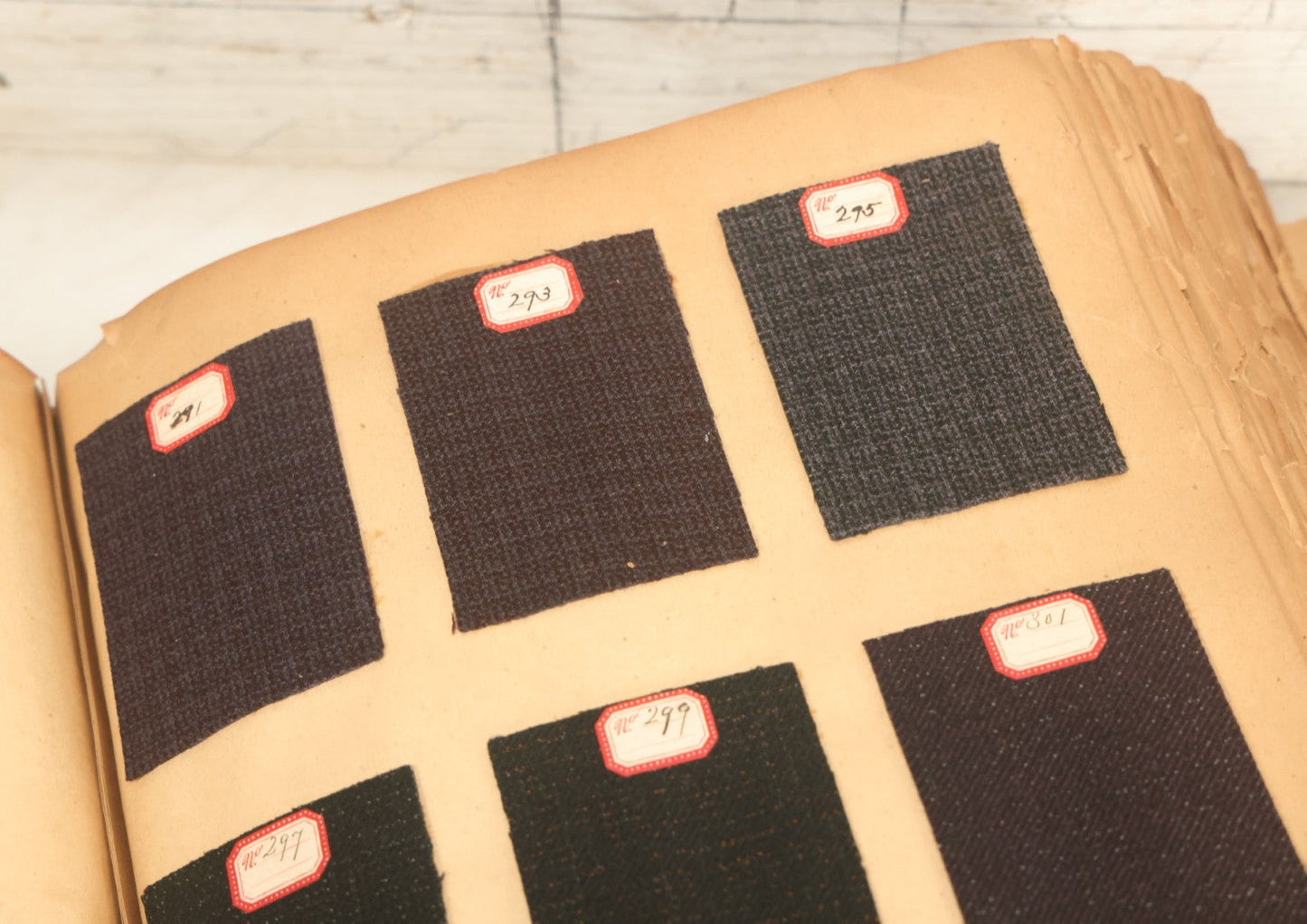 Lot 032 - Antique Sample Fabric Wool Swatch Book From Calumet Woolen Co., Styles No. 1195-1661 & Great River Woolen Co., Styles No. 1-1303, Containing Dozens Of Fabric Samples, Missing Front Cover, Dated 1894 