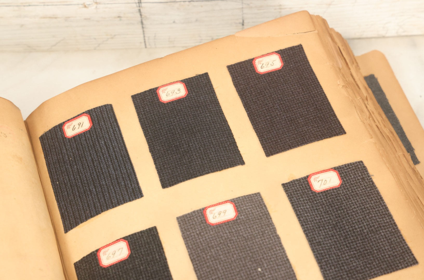 Lot 032 - Antique Sample Fabric Wool Swatch Book From Calumet Woolen Co., Styles No. 1195-1661 & Great River Woolen Co., Styles No. 1-1303, Containing Dozens Of Fabric Samples, Missing Front Cover, Dated 1894 