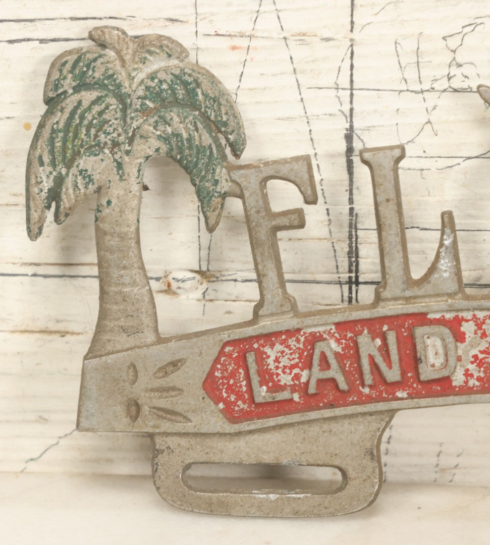 Lot 036 - Vintage Cast Aluminum Florida "Land Of Sunshine" License Plate Topper With Beach Babe In Bikini, Remnants Of Red And Green Paint