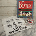 Lot 041 - Vintage "The Beatles" Band Collectibles Three Piece Grouping Including Plastic "We Love The Beatles" Shopping Bag, "The Compleat Beatles" Laserdisc, And Beatlefest 1984 Program