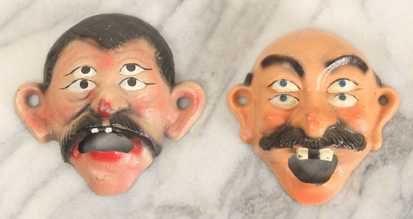 Lot 049 - Pair Of Modern Reproduction Cast Iron Four Eyed Character Bottle Openers