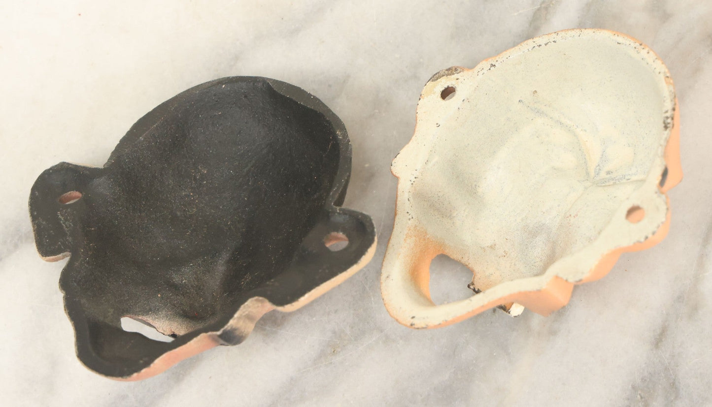 Lot 049 - Pair Of Modern Reproduction Cast Iron Four Eyed Character Bottle Openers