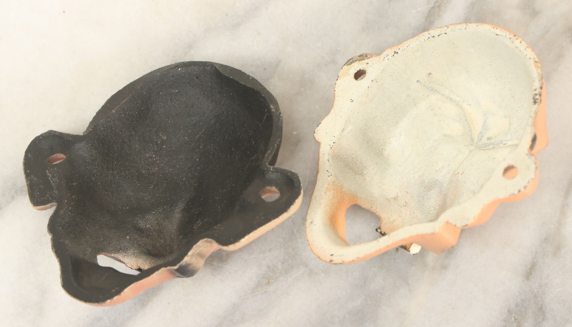 Lot 049 - Pair Of Modern Reproduction Cast Iron Four Eyed Character Bottle Openers