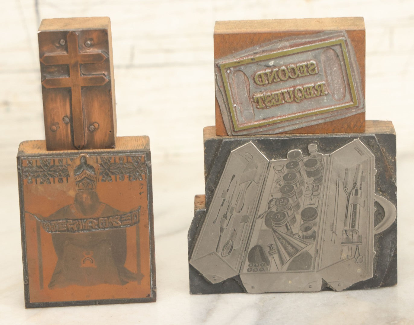 Lot 054 - Grouping Of Four Antique Or Vintage Printing Blocks Including Patriarchal Cross, Esoteric Priest, Toolkit With Hair Care Implements, And "Second Request"