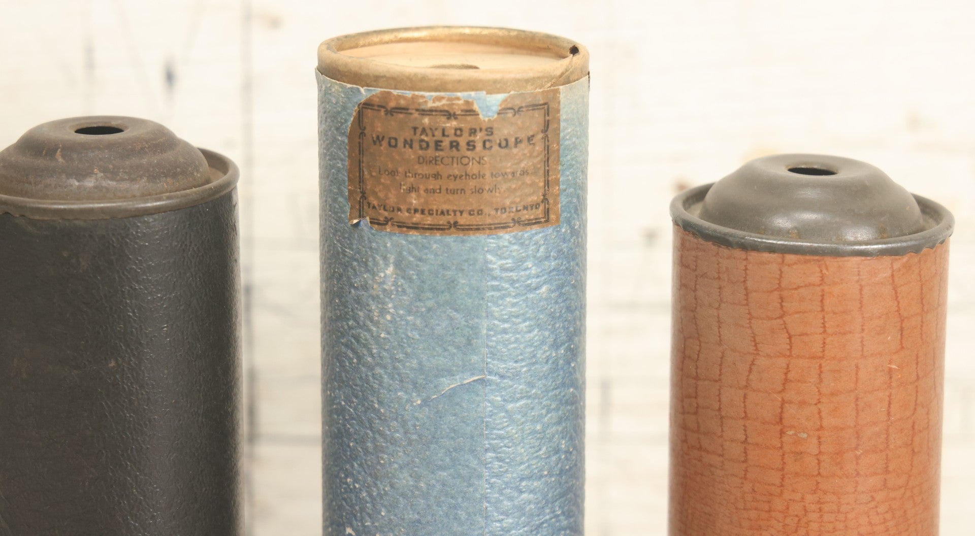 Lot 055 - Grouping Of Three Antique Leatherette Wrapped Kaleidoscopes, Including One With Paper Label, "Taylor's Wonderscope" By Taylor Specialty Co., Toronto, Canada