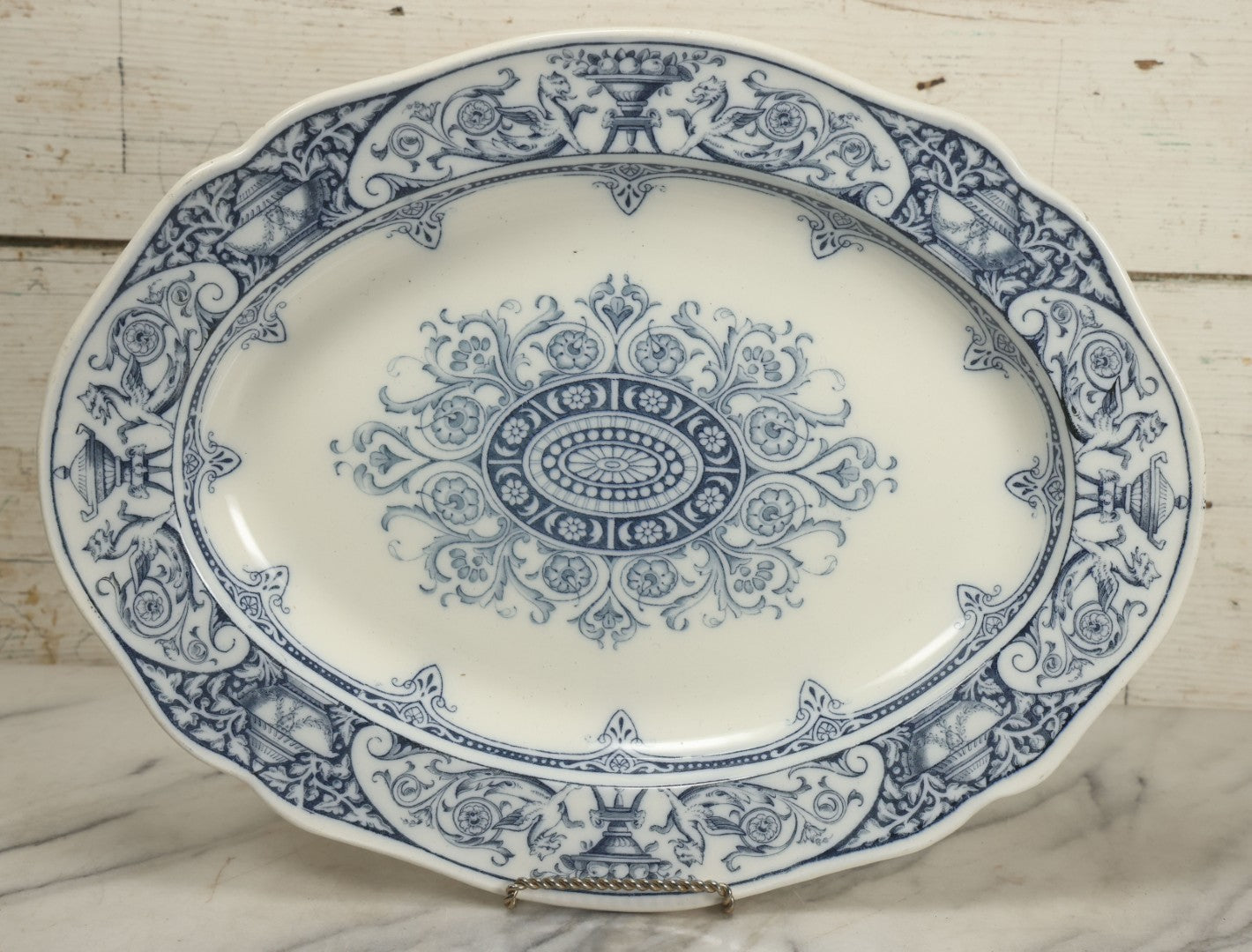 Lot 064 - Vintage Wedgwood Neoclassical Revival Transferware Platter With Griffin Motif, Greco-Roman Architectural Elements, Urns, Circa 1932, 17-1/4" x 13-1/2"