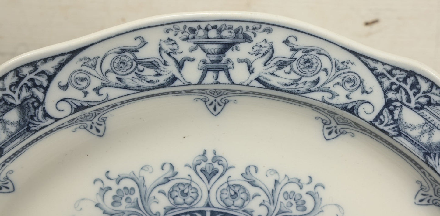 Lot 064 - Vintage Wedgwood Neoclassical Revival Transferware Platter With Griffin Motif, Greco-Roman Architectural Elements, Urns, Circa 1932, 17-1/4" x 13-1/2"